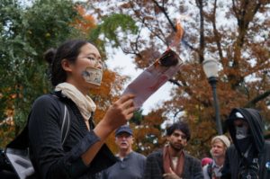 Portlander burns her ballot during the November 3rd Resist Austerity event.